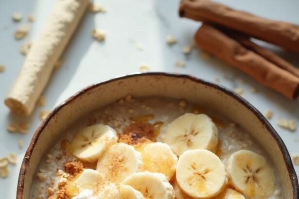"Overhead shot of banana oat power bowl with sliced bananas, Greek yogurt and cinnamon on white marble surface"