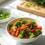 "Colorful stir fry vegetables with glossy sauce in white ceramic bowl on marble countertop"